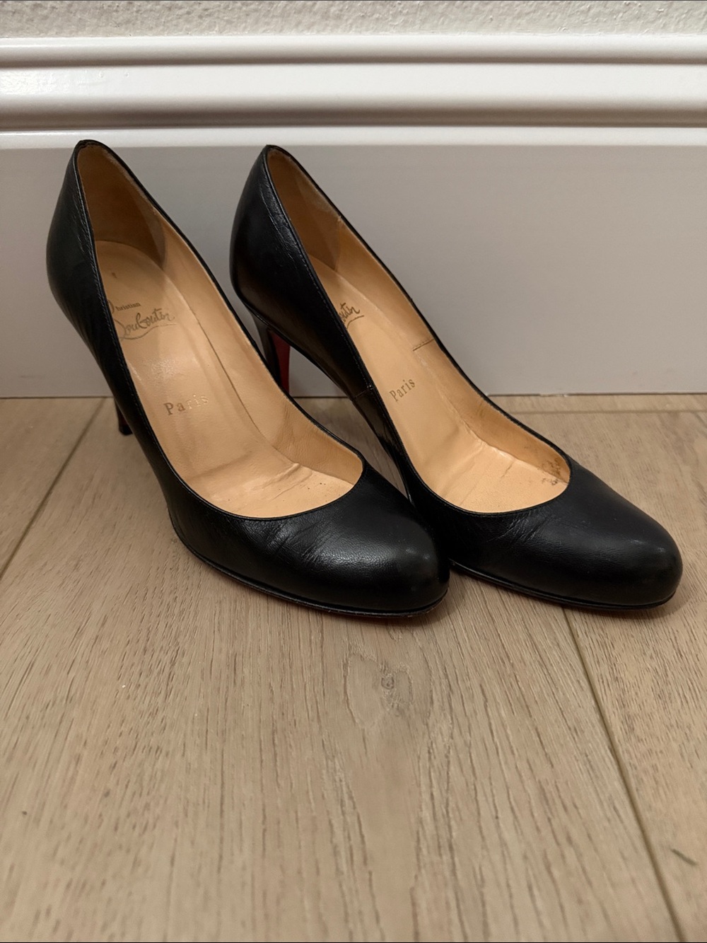 Christian Louboutin Black Leather Pumps with Signature Red Soles